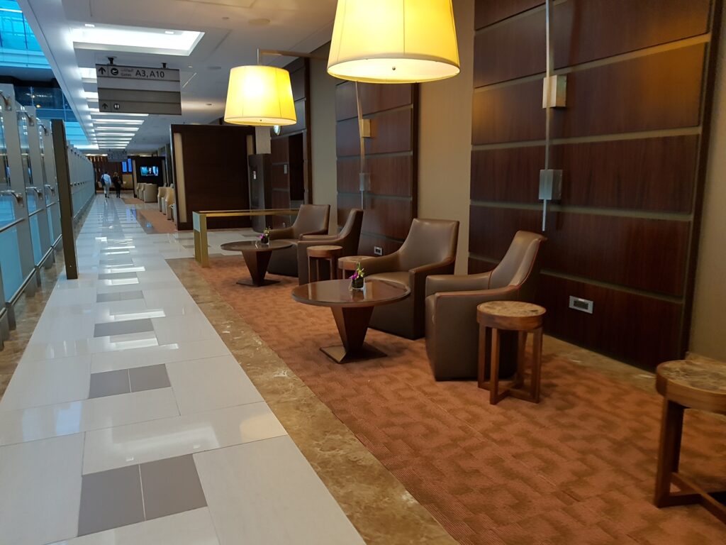 Emirates first class lounge seating by shower area