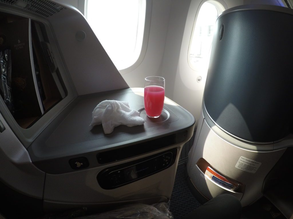 SQ Business class welcome drink and hot towel