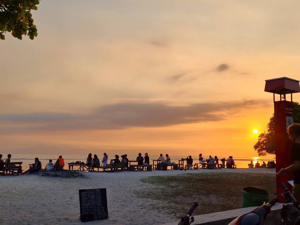 People watching sunset at Gilli T People watching sunset at Gilli T